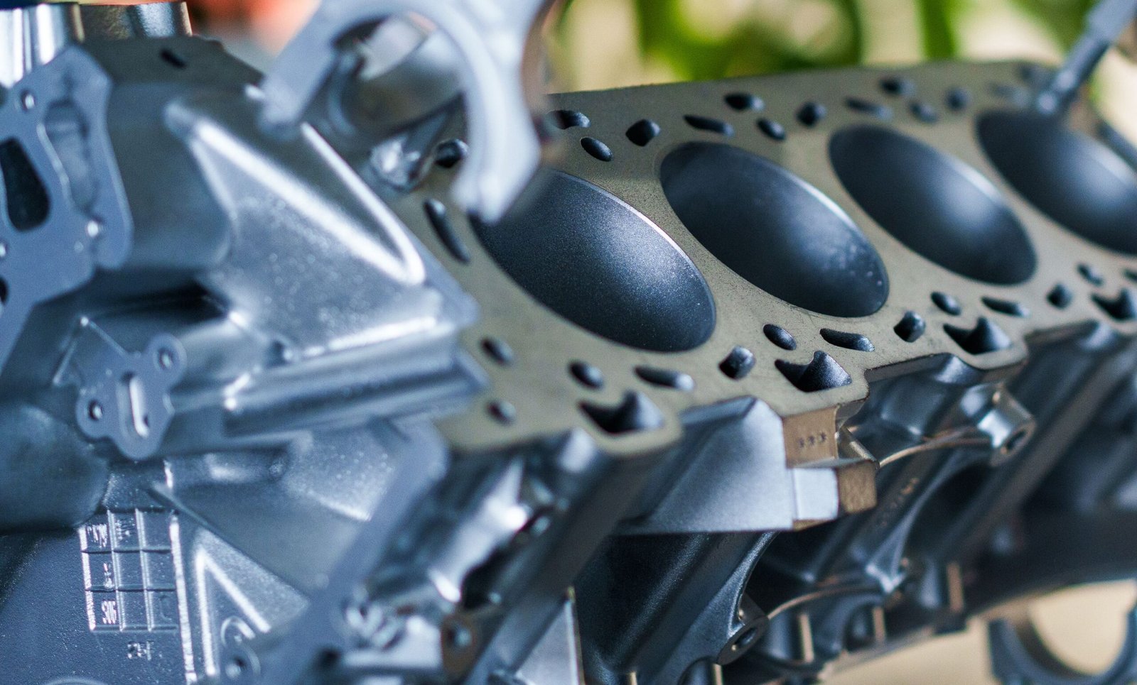 Detailed close-up of a metallic engine block showcasing industrial machinery elements.